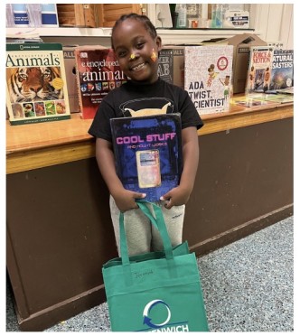 Picture of boy holding a bag of books
