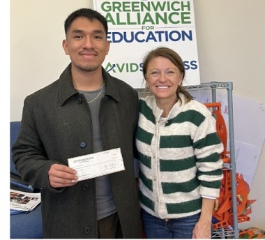 Picture of Trish Rohr and John Castenda holding scholarship check