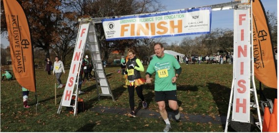 Turkey Trot Finish Line Banner with runners