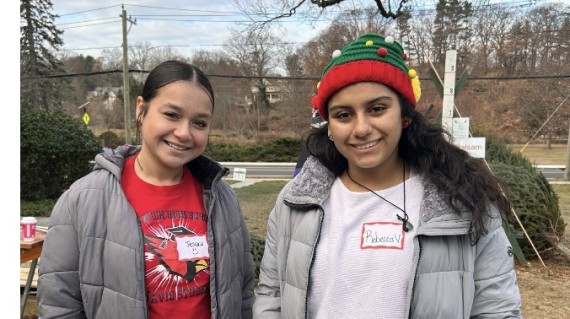 Two students helping out at Tree sale